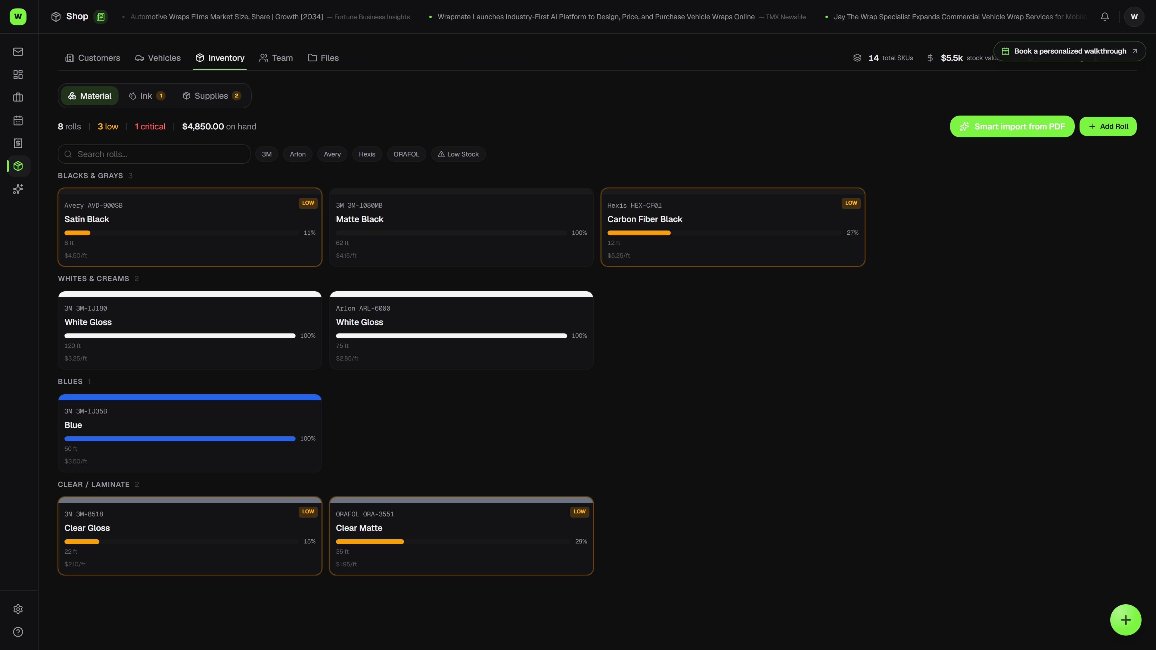 Overlam inventory screen showing vinyl rolls by brand, color, and remaining footage (dark mode)