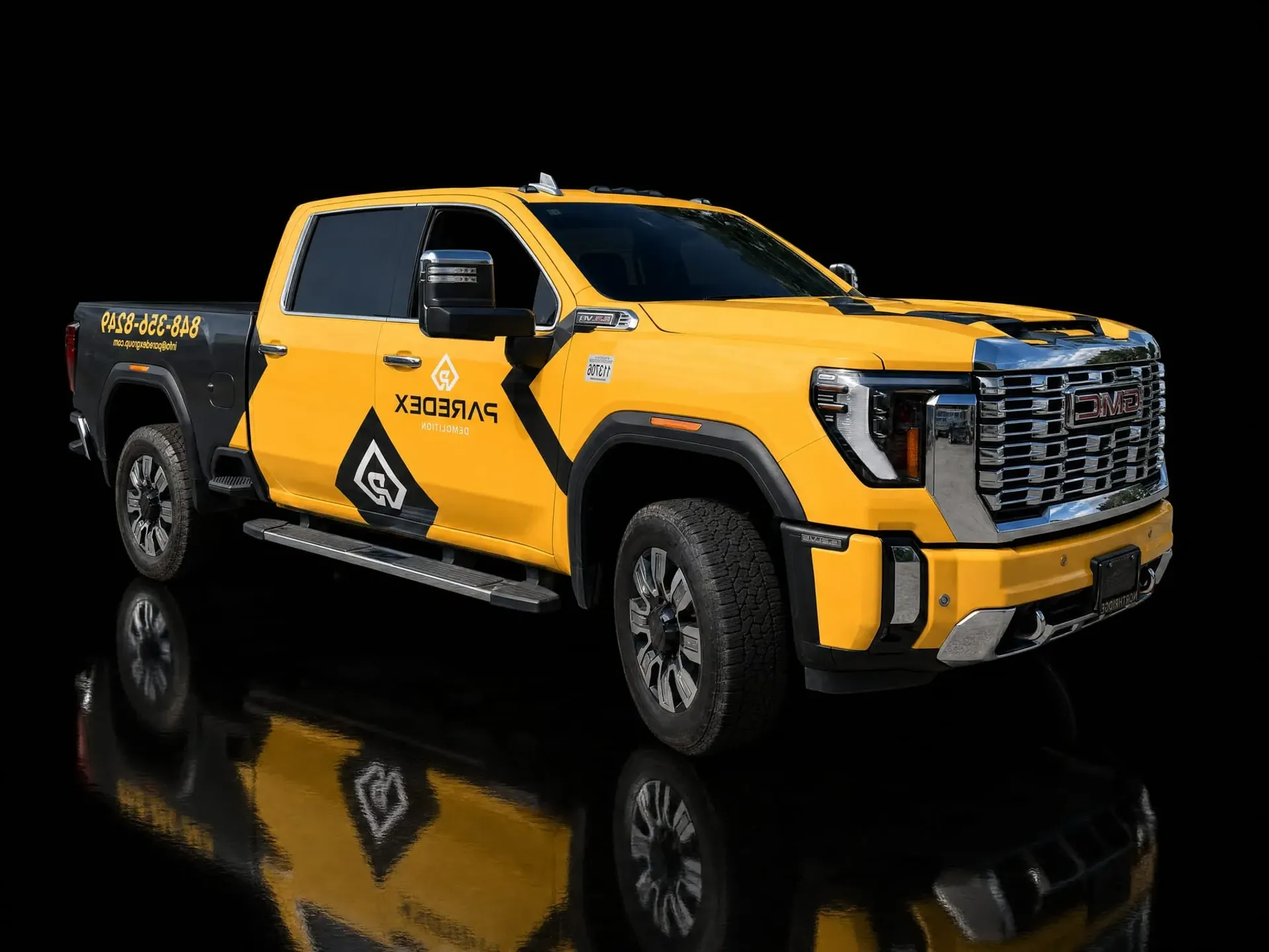 Wrapped heavy-duty truck in a black studio
